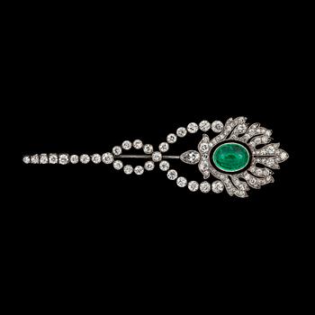 947. A cabochon-cut emerald and diamond brooch. Total carat weight of diamonds circa 3.80 cts.