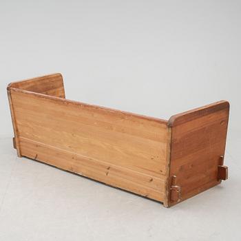 An Axel Einar Hjorth 'Lovö' stained pine sofa, Nordiska Kompaniet, Sweden 1930's.