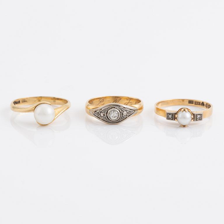 Three pearl and diamond rings.