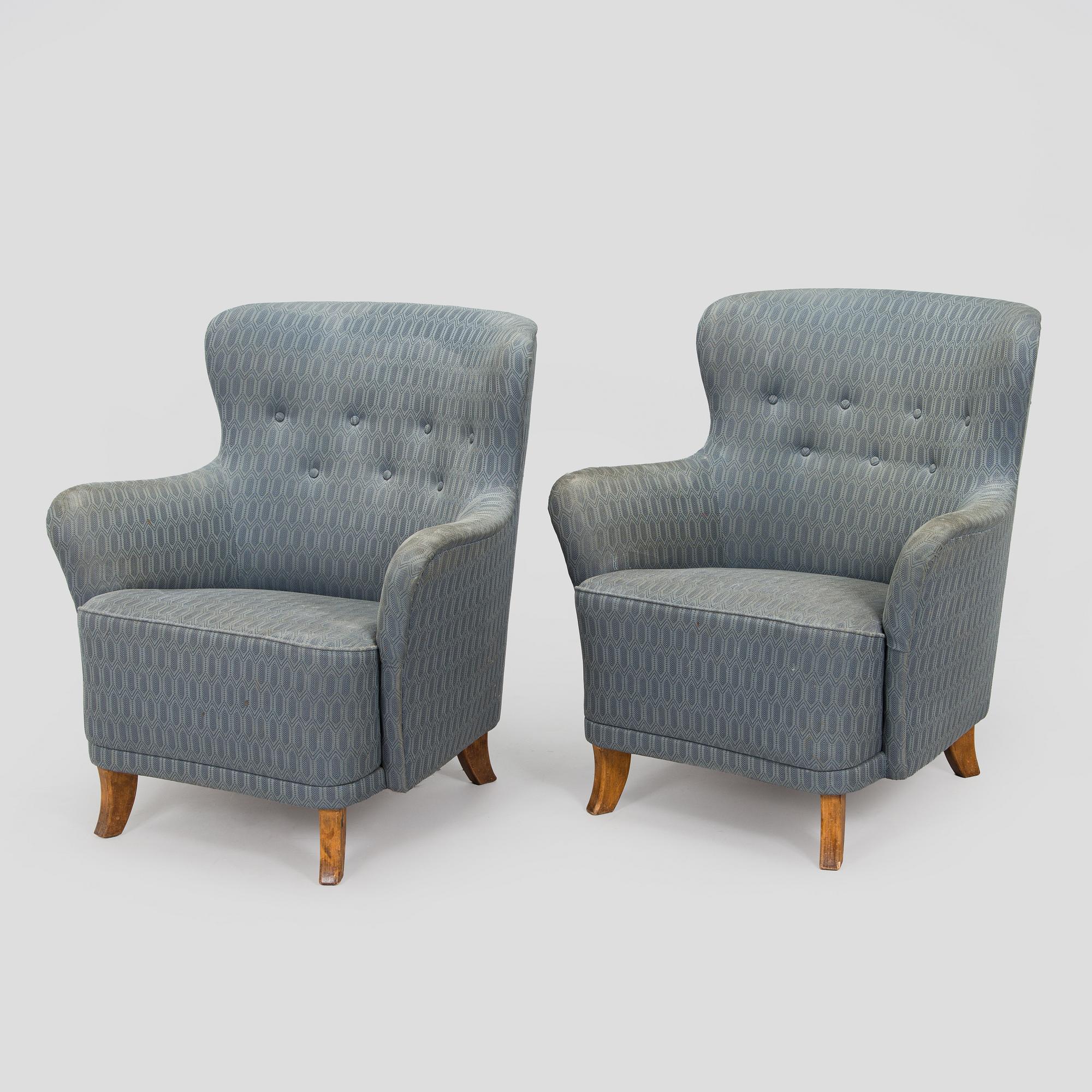 A pair of mid-20th century armchairs.