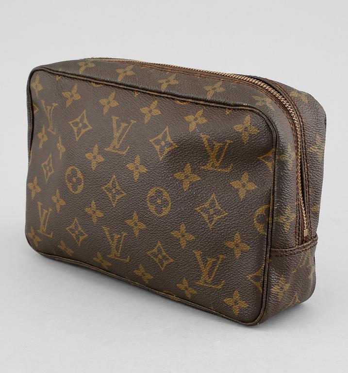 A Louis Vuitton "Trousse Toilette 23" beauty bag.