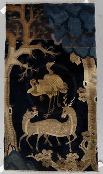 A rug, a semi-antique Baotou figural, ca 161,5 x 86,5-91,5 cm.