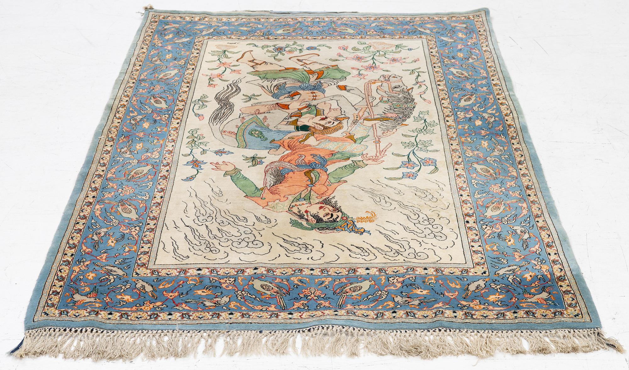 An Isfahan, figural rug, signed, c. 172 x 109 cm.