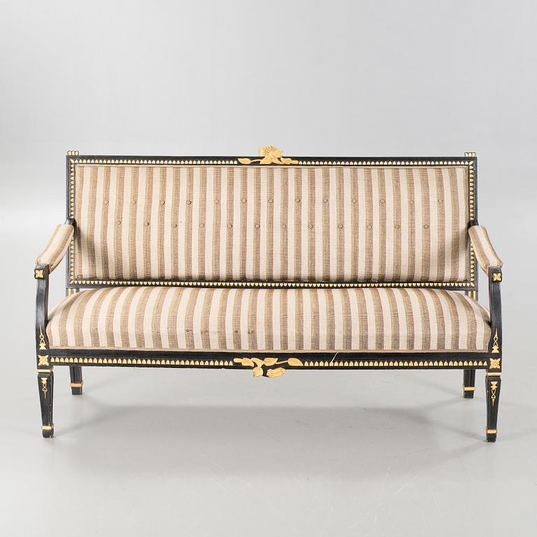 A gustavian style table and sofa, around the year 1900.