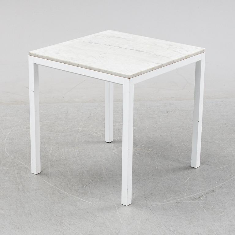 A marble top table, 21th century.