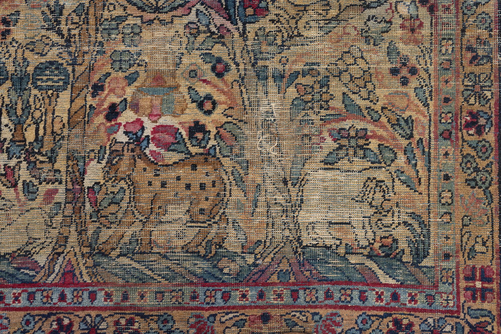A semi-antique Kerman carpet, c. 325 x 203 cm.