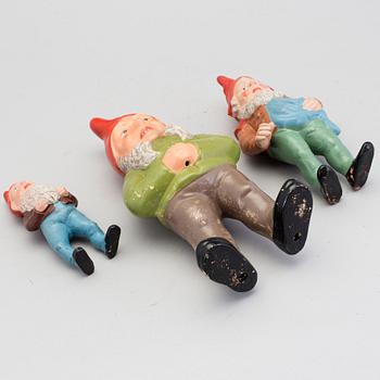 Three painted terracotta santa claus figurines from the first half of the 20th century.