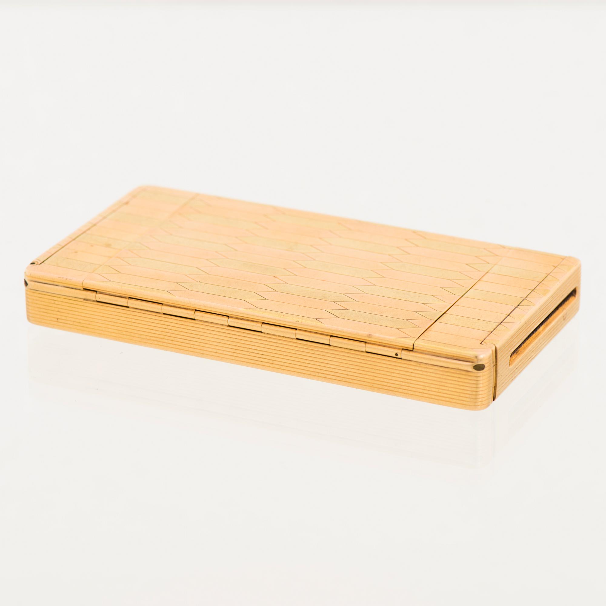A CARTIER CASE, 18K gold in three colours, cabochon cut sapphires.