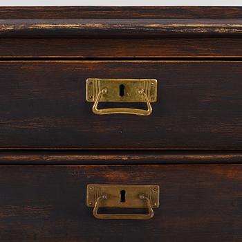 A chest of drawers, circa 1900.