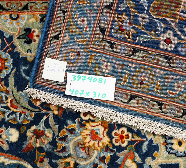 A Kashan carpet, signed Isfahanian, a. 407 x 310 cm.