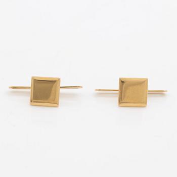 A pair of shirt studs 18K gold.