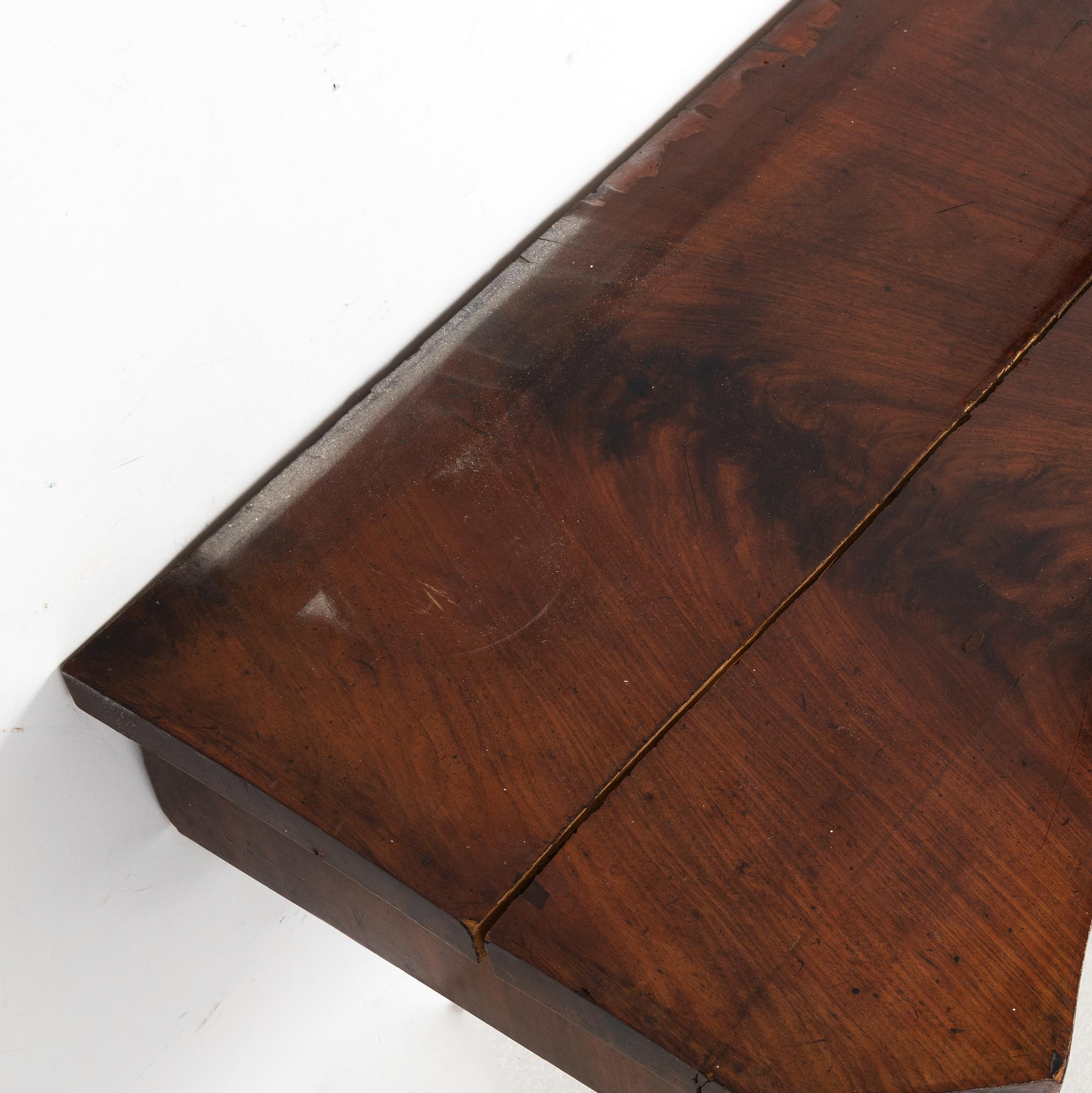 A 19th Century mahogany mirror with a console table.