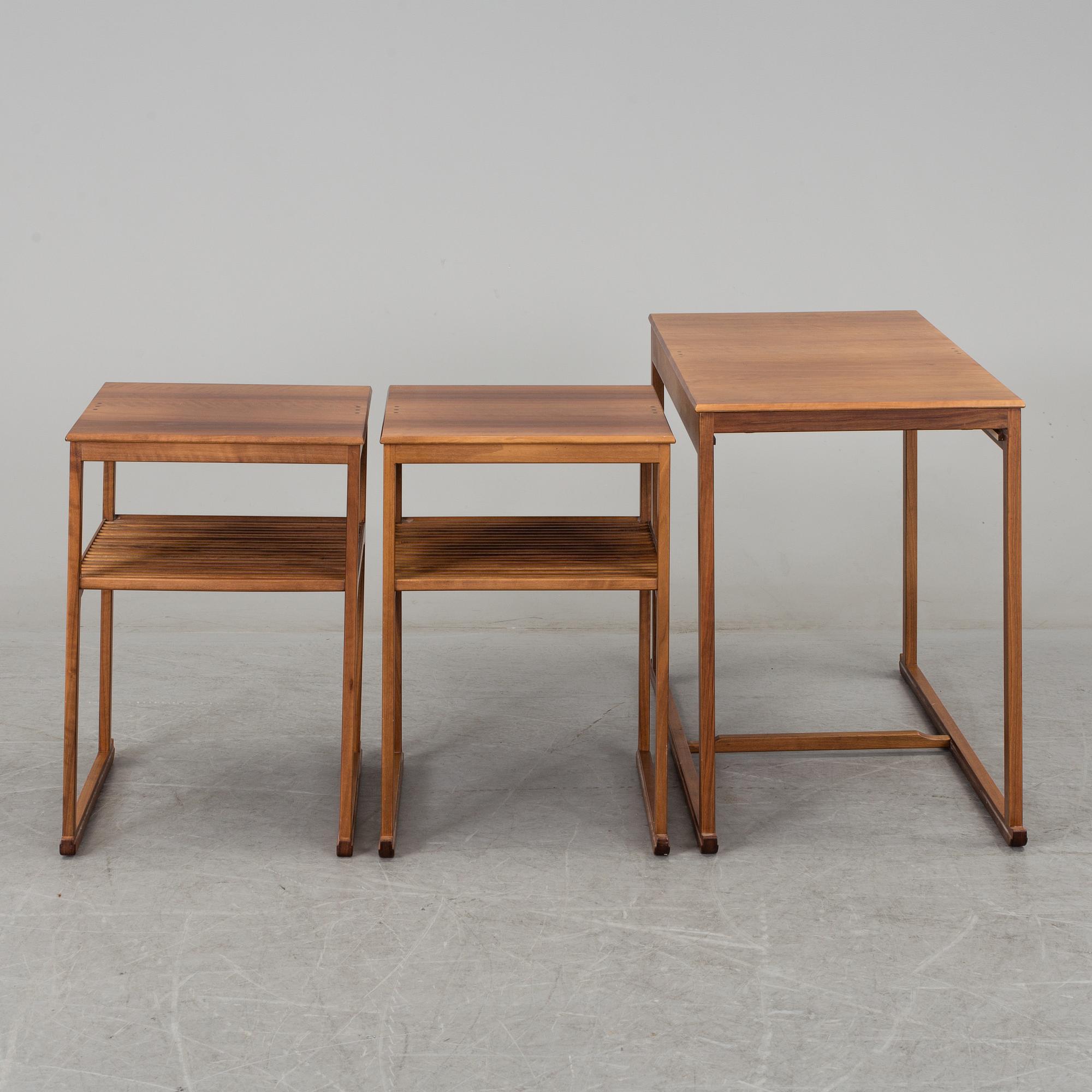 CARL MALMSTEN, a 'Släden' nest of three mahogany tables.