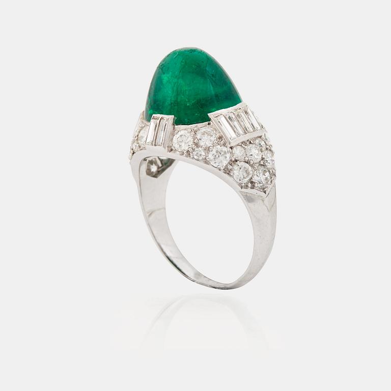 A cabochon-cut emerald, baguette, single and brilliant-cut diamond ring.