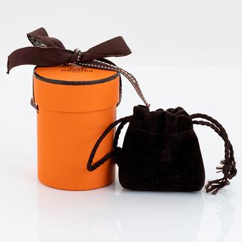 Hermès nyckelring i form av en uggla 18K guld med rubiner.