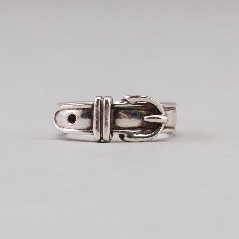 A silver ring by Hermès.