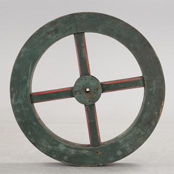 A early 20th century wooden wheel.
