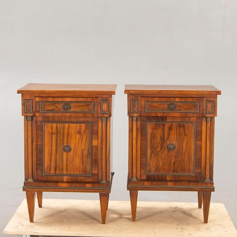 A pair of walnut Empire style bedside tables first half of the 20th century.