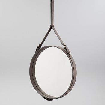 A mirror "Adnet" with leather hanging in original box, designed 1950 by Jacques Adnet for Gubi, Denmark.