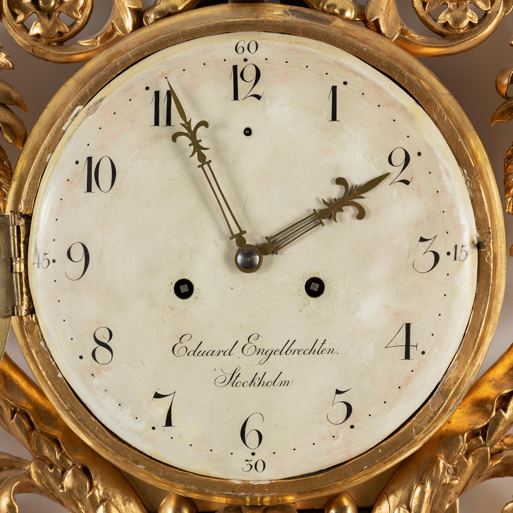 A late Empire wall clock by E. Engelbrechten.
