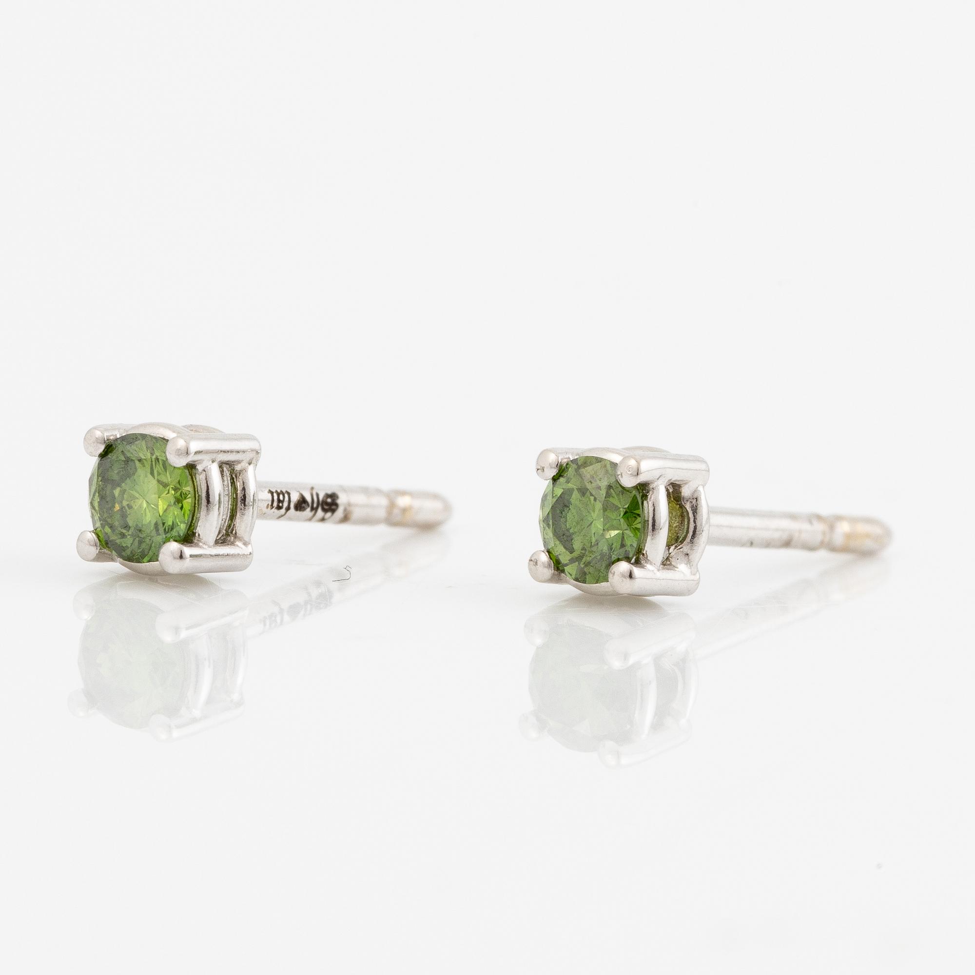 Earrings 18K white gold with colour-treated green brilliant-cut diamonds.
