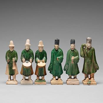 132. A group of six green and yellow glazed pottery figures, Ming dynasty (1368-1644).