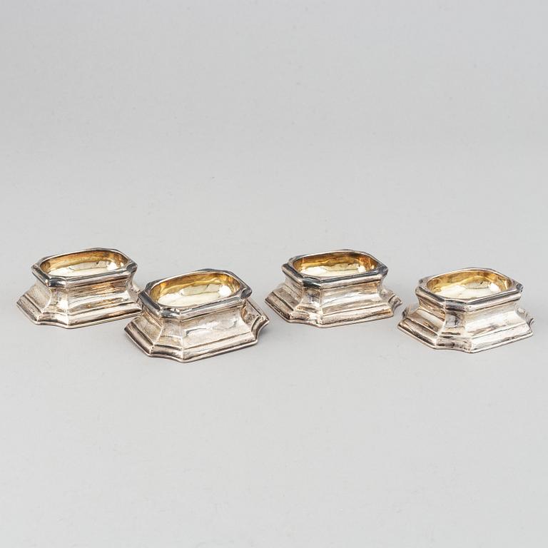 Four English early 18th century parcel-gilt silver salt-cellars, mark of Edward Wood, London 1727.