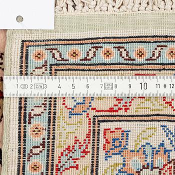 A Turkish silk rug, circa 133 x 101 cm.