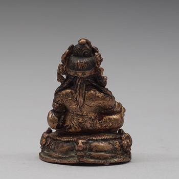 A gilt copper alloy figure of Kubera, Tibet, 15th Century.