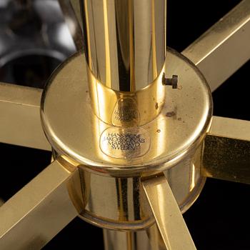 A brass chandelier with two glass globes by Hans-Agne Jacobsson, Markaryd.