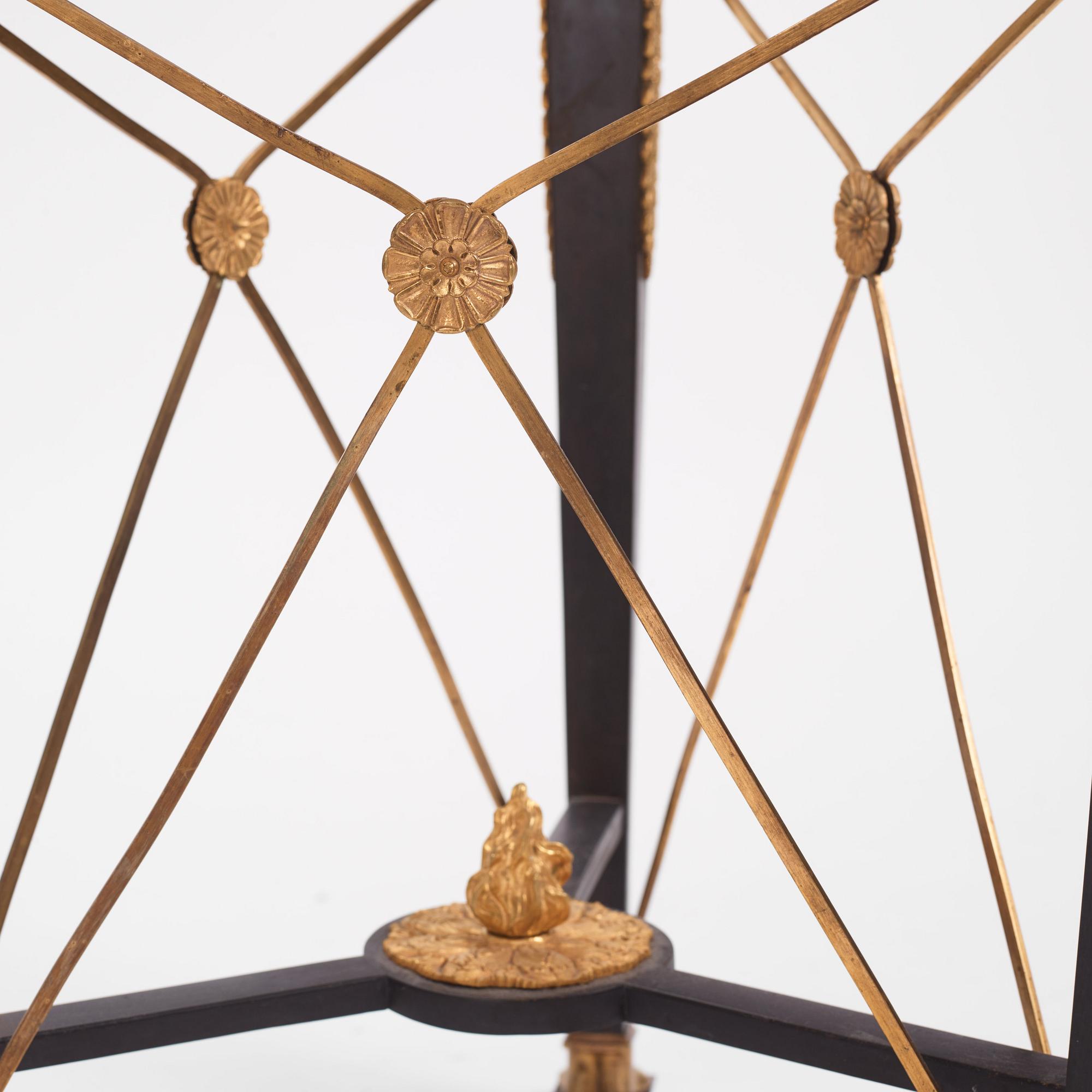 A French Empire-style gilt and patinated bronze  gueridon, later part of the 19th century.