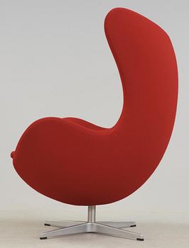 An Arne Jacobsen red fabric 'Egg' chair, Fritz Hansen, Denmark 2002.