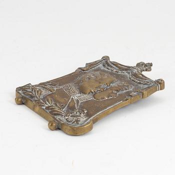 A 19th century bronze plaque.