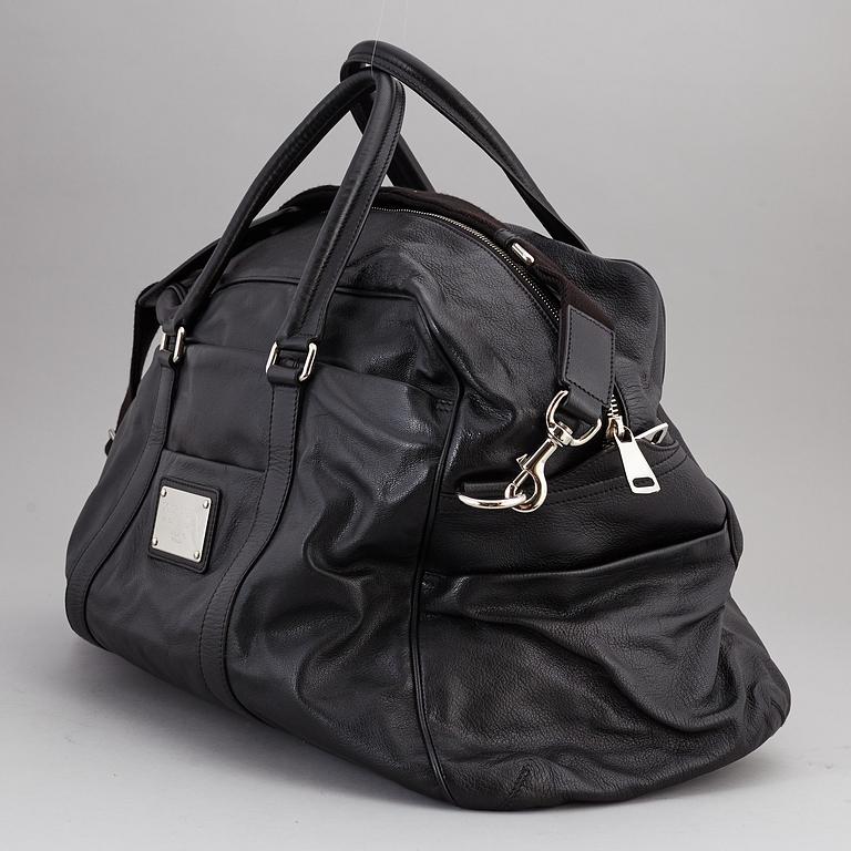 DOLCE & GABBANA, a black leather weekend bag, 2009.