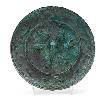 A broze mirror, presumably Tang dynasty (618-907 A.D.).