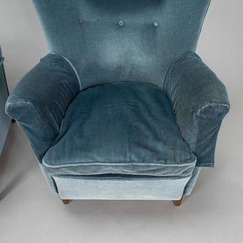 A pair of mid-20th century armchairs.