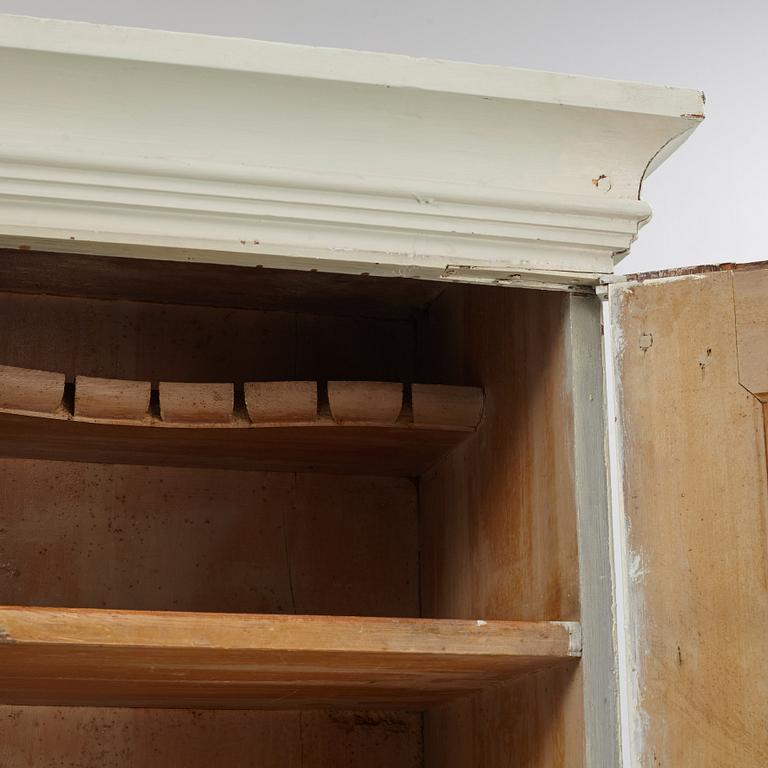 A 18th century panited cabinet.