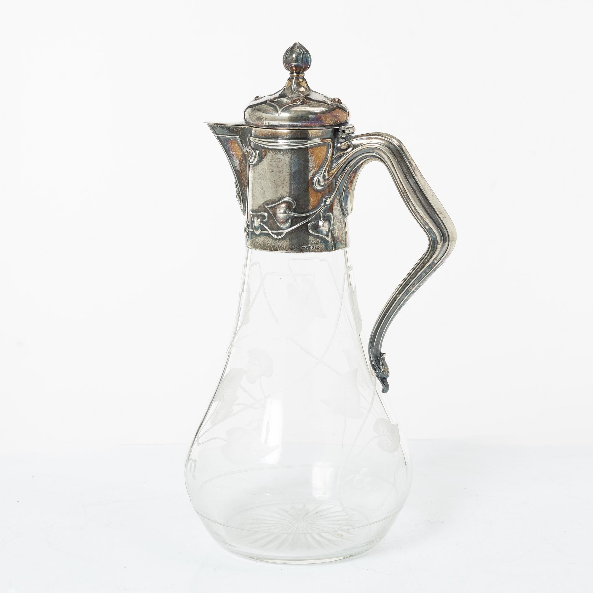 A silver and glass Art Nouveau claret jug, David Andersen, Stockholm, 1901.