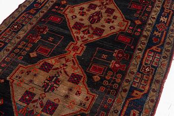 An Oriental rug, c. 282 x 154 cm.