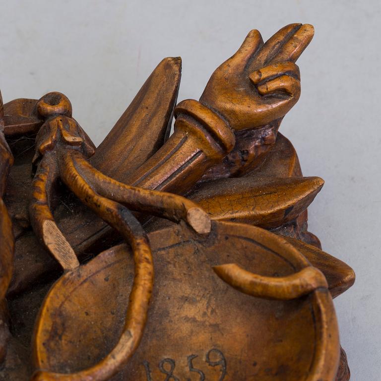 A CARVED WOOD INK STAND, dated 1859.