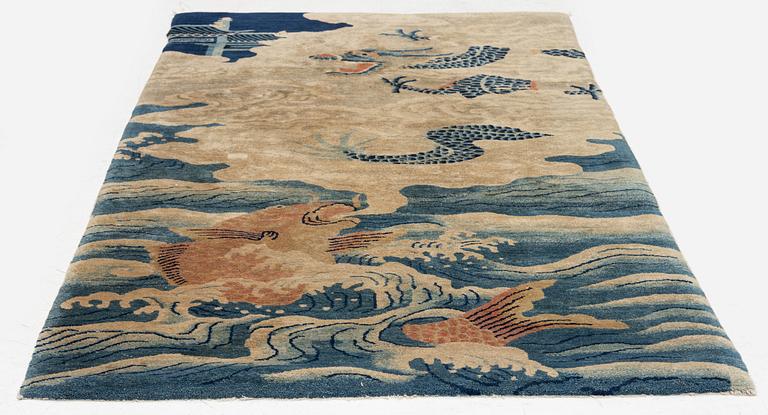 An antique Baotou rug, northern China, late Qing dynasty, circa 1900. c. 178x90 cm.