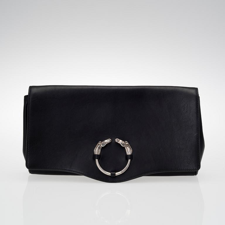 A LEATHER RIBOT HORSE HEAD CLUTCH.