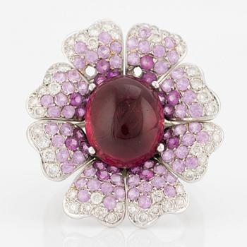 Ring, Gianni Lazzaro, 18K white gold in the shape of a flower with cabochon-cut tourmaline, pink sapphires, brilliant-cut diamonds.