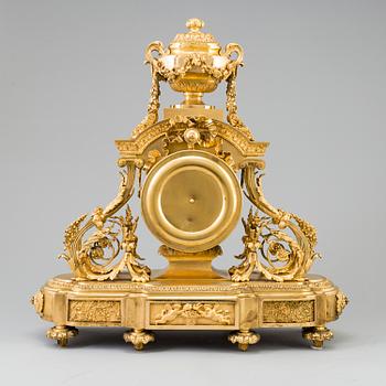 A Louis XVI-style late 19th century gilt bronze mantel clock.