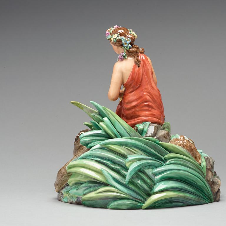 A Royal Copenhagen allegorical porcelain figure representing 'America', Denmark, 1920's.