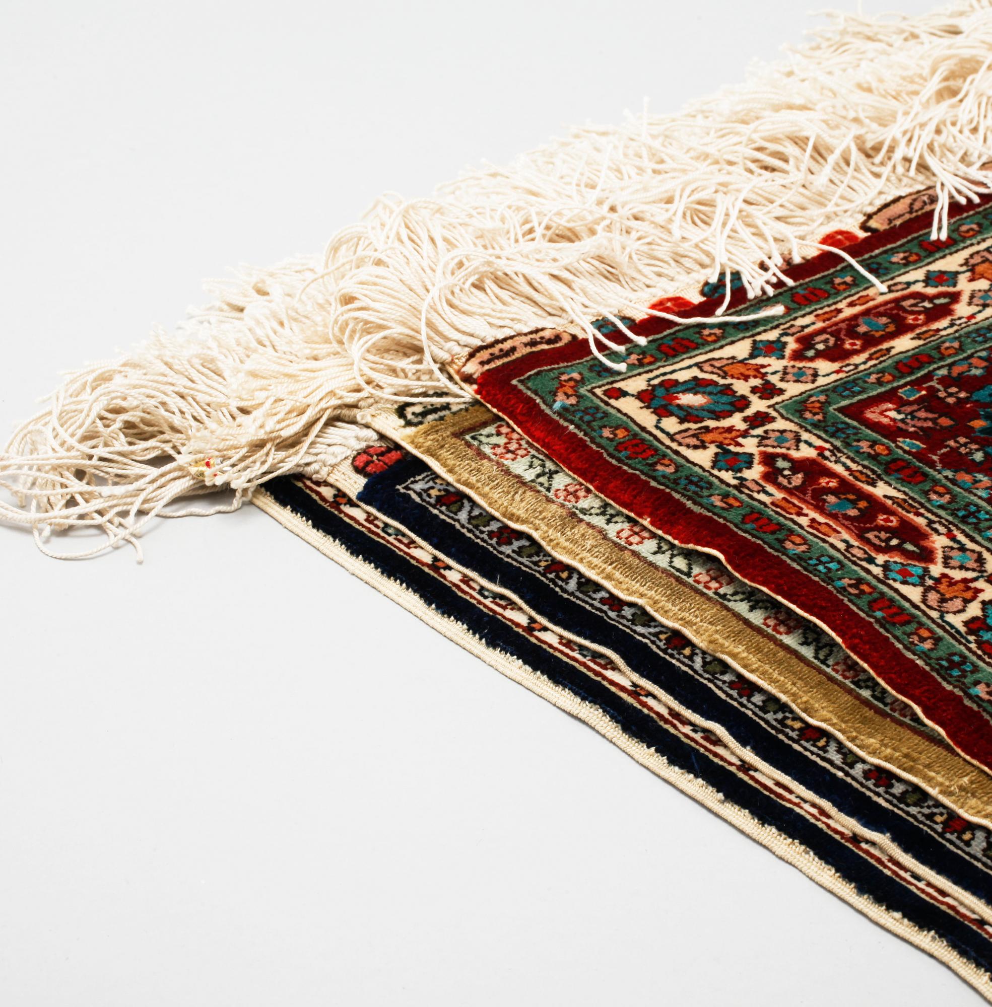 Four silk rugs/pads, probably Hereke, ca 33 x 33 cm.