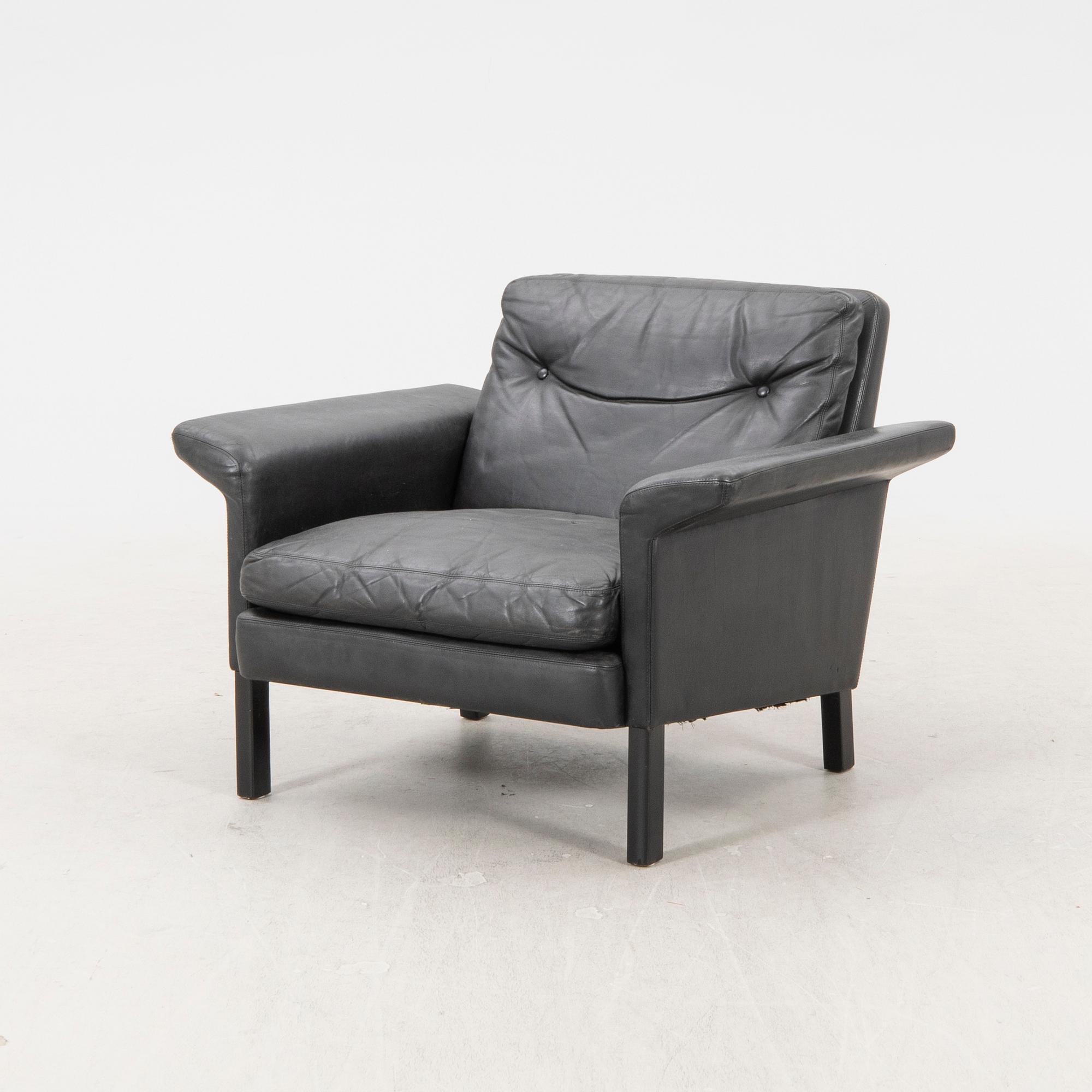 A 1960/70s Hans Olsen leather armchair.