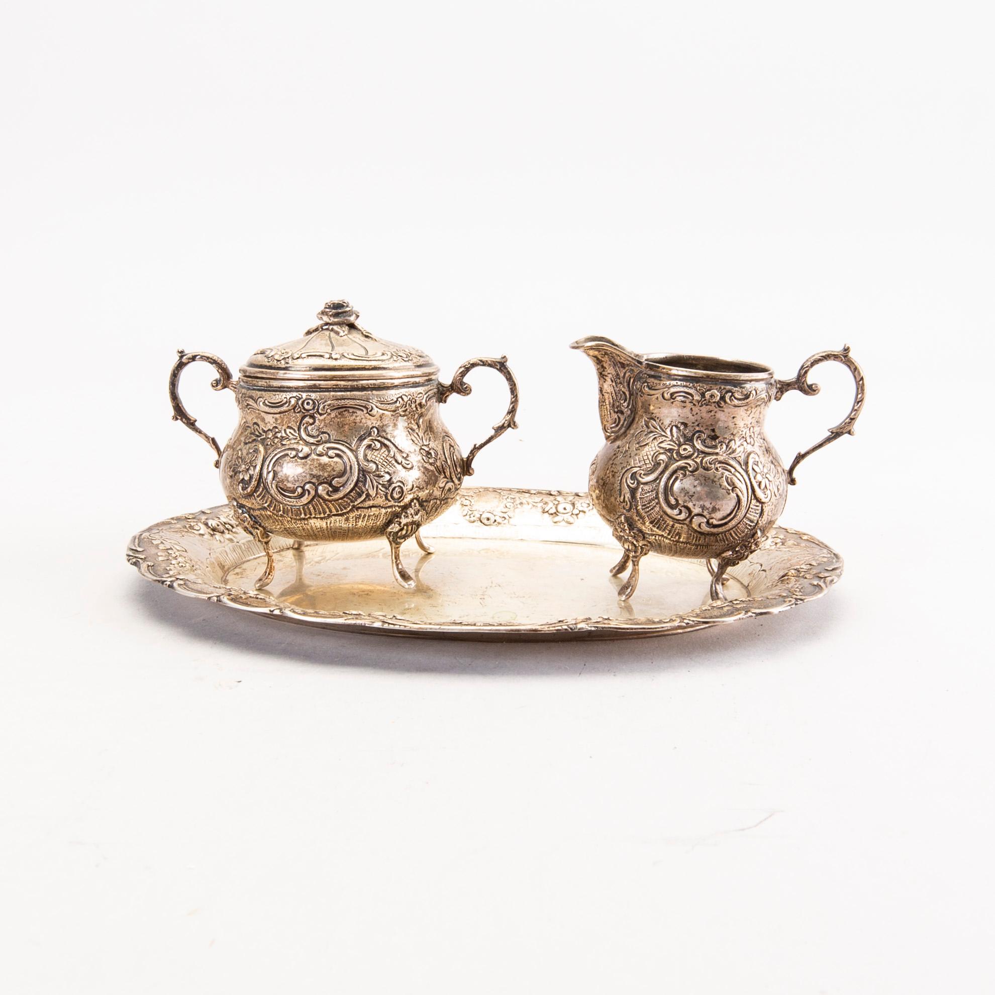 A Swedish 20th century set of three pcs of creamer and sugar-bowl, mark of JL Hultman Stockholm 1954, total weight 422 g.