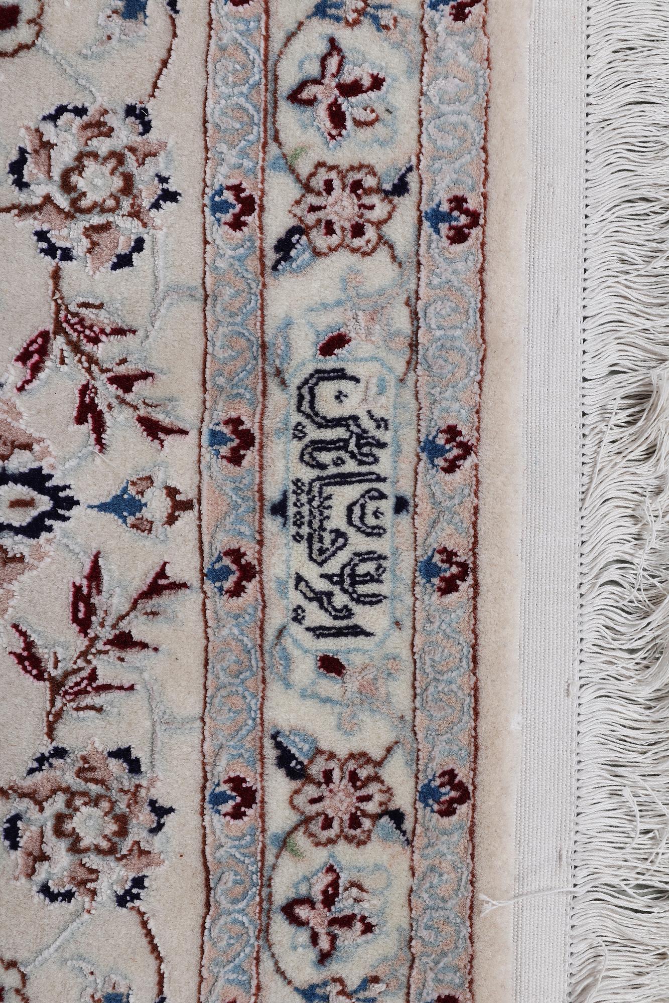 A carpet, Nain, part silk, ca 341 x 245 cm.