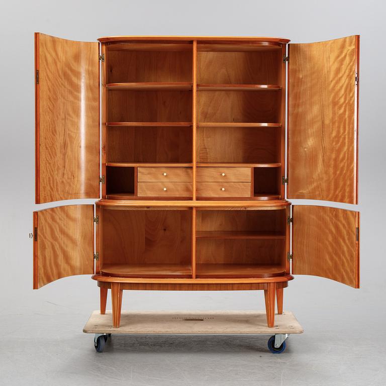 A mahogany veneered cabinet, mid 20th Century.